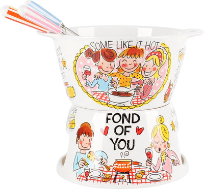 Das blonde Amsterdam informiert sich über das Fondue-Set