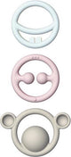 Moluk Nigi, Nagi Nogi-Set in Pastellfarben, Set mit 3 taktilen Beißringen in verschiedenen Farben, aus Silikonkautschuk, in Box 12,5 x 2 x 25,8 cm, 0+