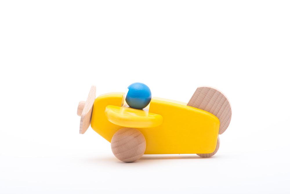 Bajo-Holzflugzeug mit Pilotengelb. 1