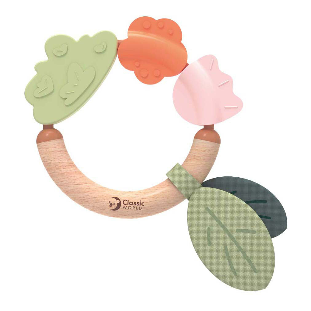 Klassischer Beißring aus Holz aus Gras