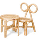 Puppenstuhl und Tisch aus Rattan.