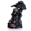 Schwarzes Gold Ganesh sitzt unter Baum