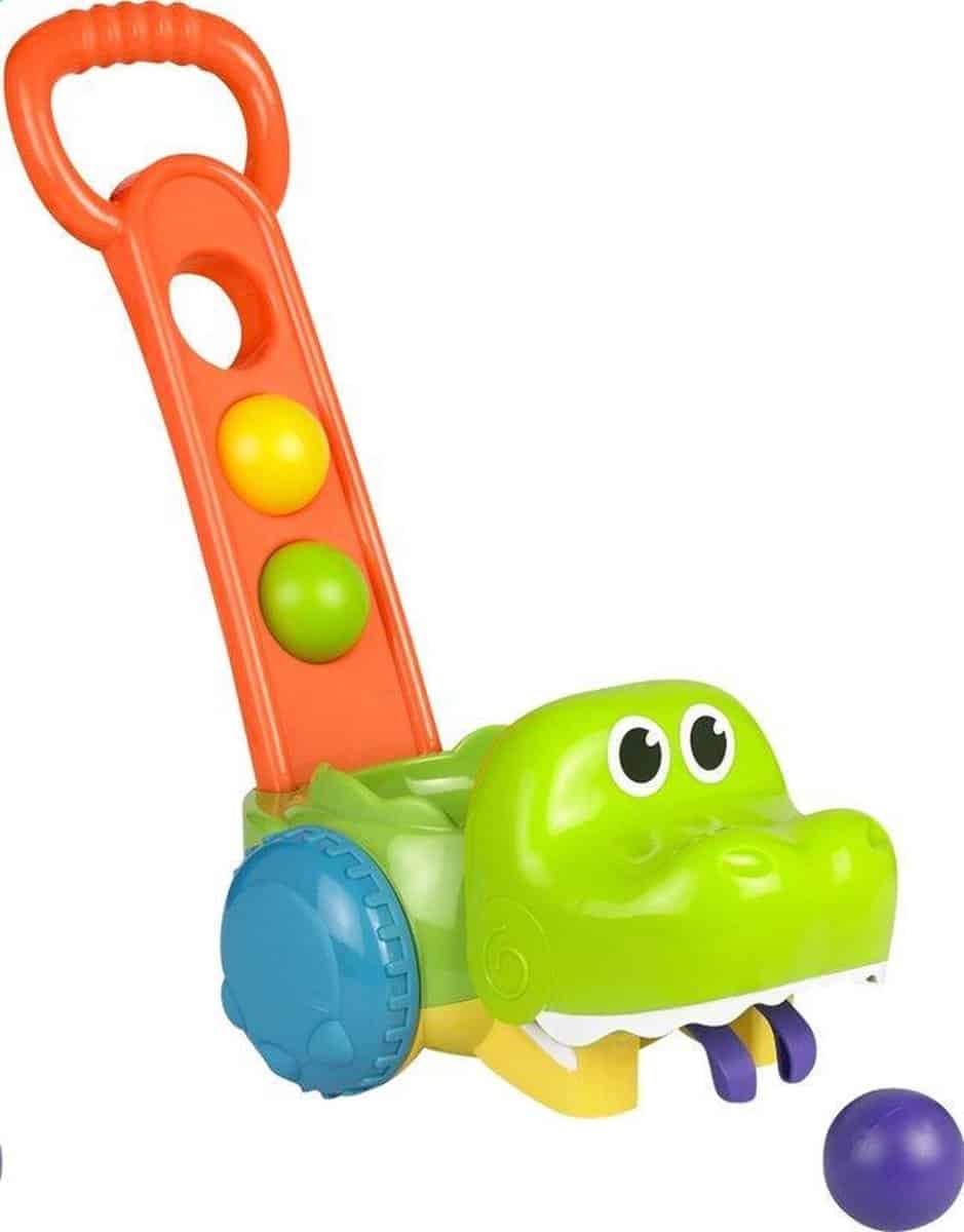 Schieben Sie Krokodil mit Bällen und Klang